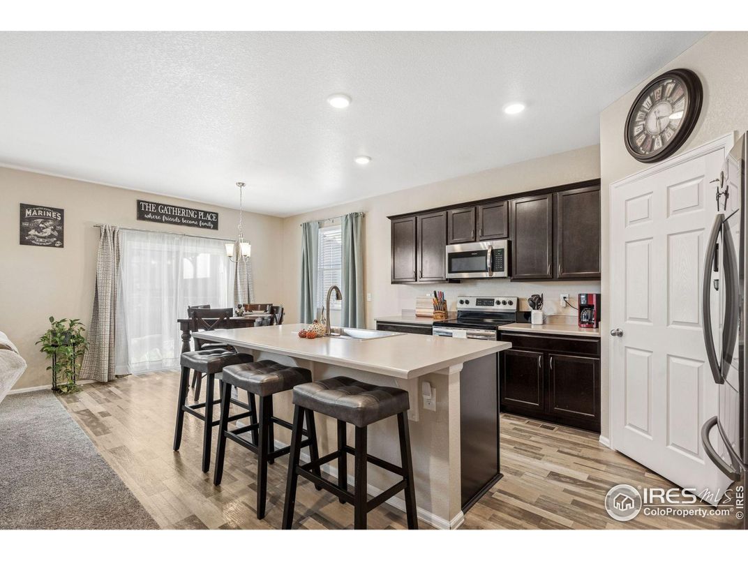 Dining room, Interior, Kitchen, Pendant Lights, Recessed Lighting, Stainless Steel Appliances, Wood Texture Flooring