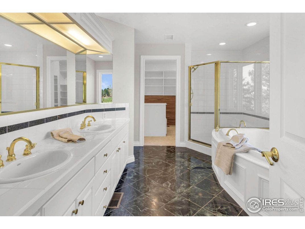 Bathroom, Dual Sink Vanities, Glass Shower, Interior, Marble, Recessed Lighting, Tile Countertops