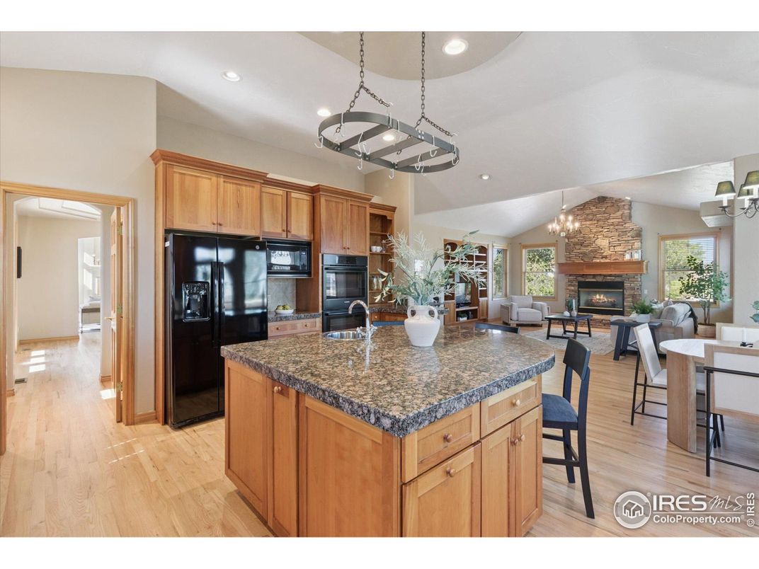 Chandelier, Dining room, Fireplace, Interior, Kitchen, Living room, Pendant Lights, Recessed Lighting, Wood Texture Flooring