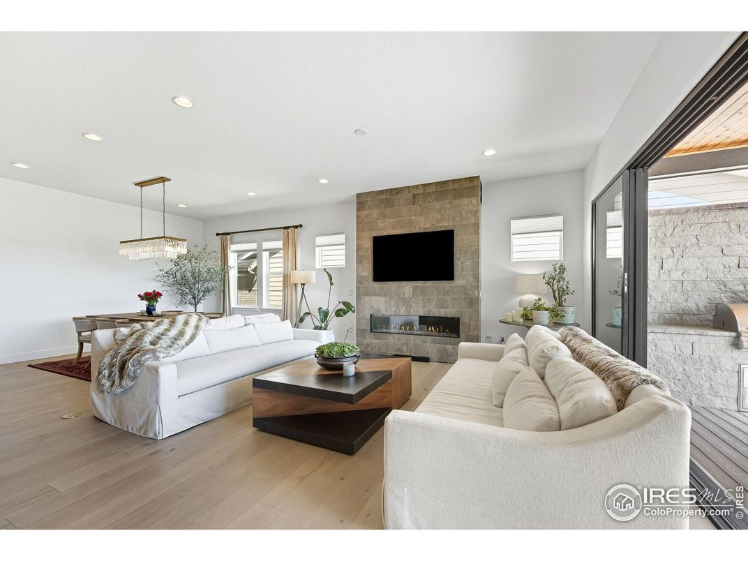 Fireplace, Interior, Living room, Pendant Lights, Recessed Lighting, Stone Walls, Wood Texture Flooring