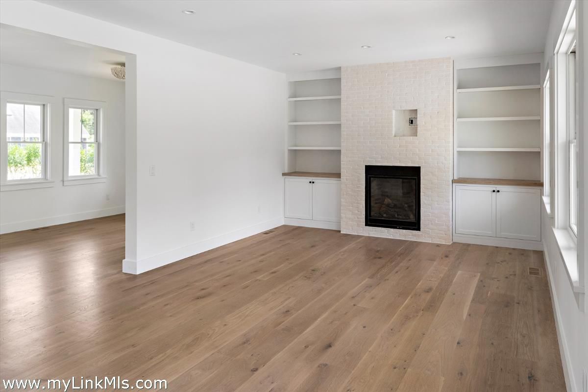 Empty room, Fireplace, Interior, Recessed Lighting, Wood Texture Flooring