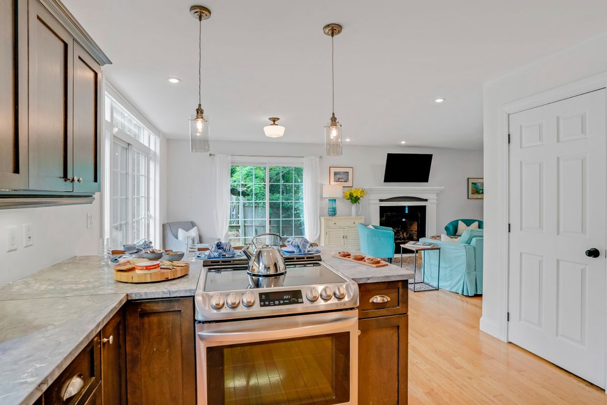 Fireplace, Interior, Kitchen, Living room, Pendant Lights, Recessed Lighting, Stainless Steel Appliances, Wood Texture Flooring