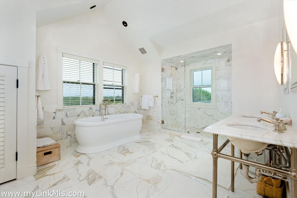 Bathroom, Free Standing Baths, Glass Shower, Interior, Marble, Marble Walls, Recessed Lighting, Water