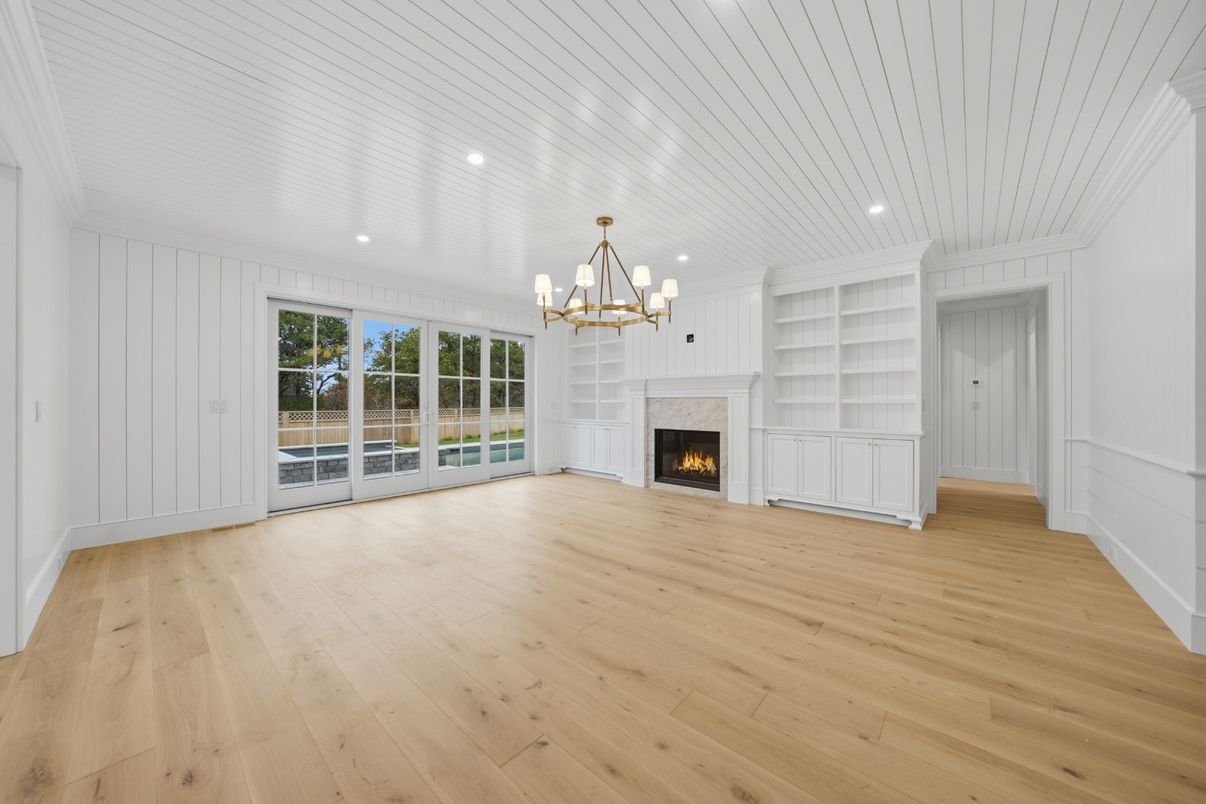 Chandelier, Empty room, Fireplace, Interior, Recessed Lighting, Wood Texture Flooring