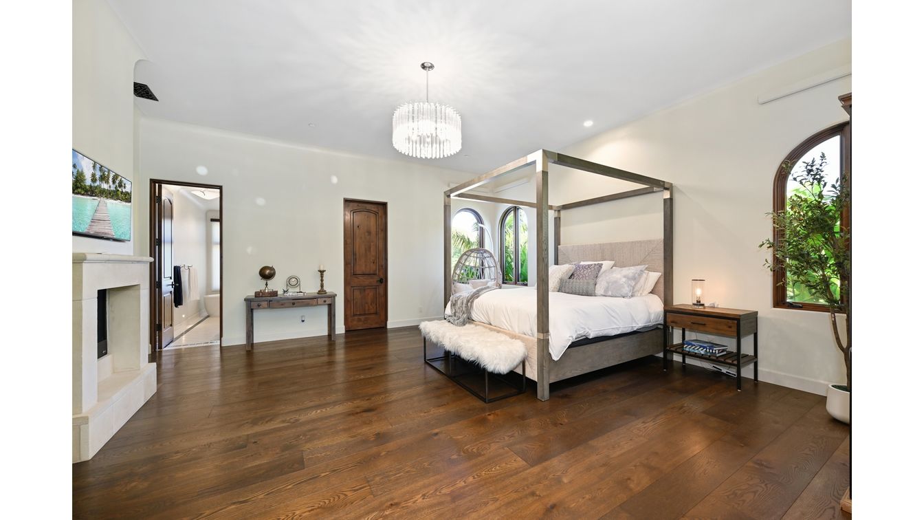 Bedroom, Chandelier, Fireplace, Interior, Recessed Lighting, Wood Texture Flooring