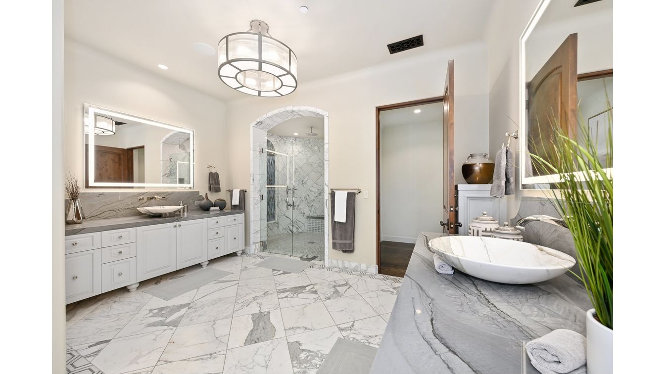 Bathroom, Chandelier, Dual Sink Vanities, Glass Shower, Interior, Marble, Marble Walls, Pendant Lights, Recessed Lighting
