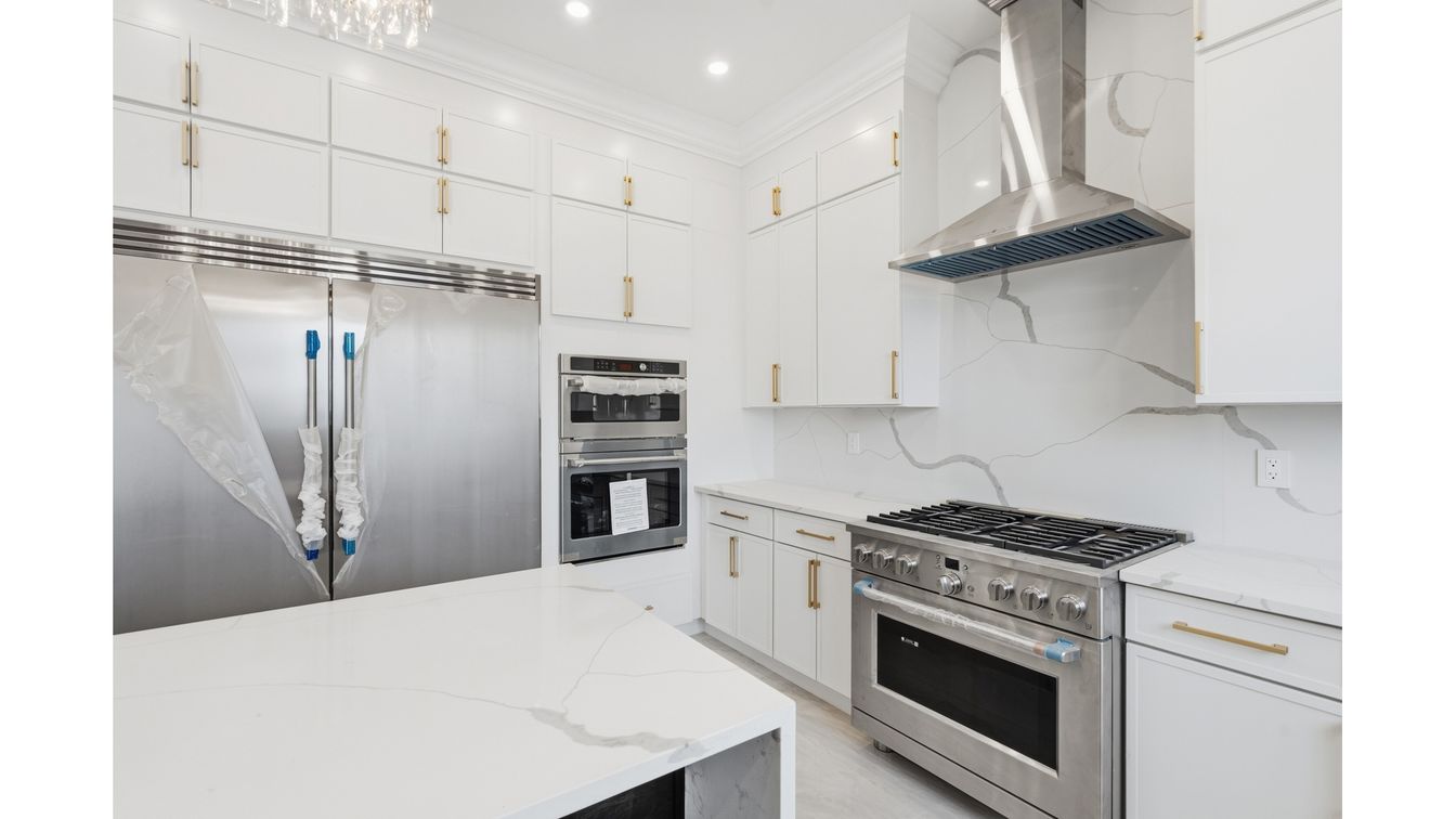 Interior, Kitchen, Marble Walls, Recessed Lighting, Stainless Steel Appliances