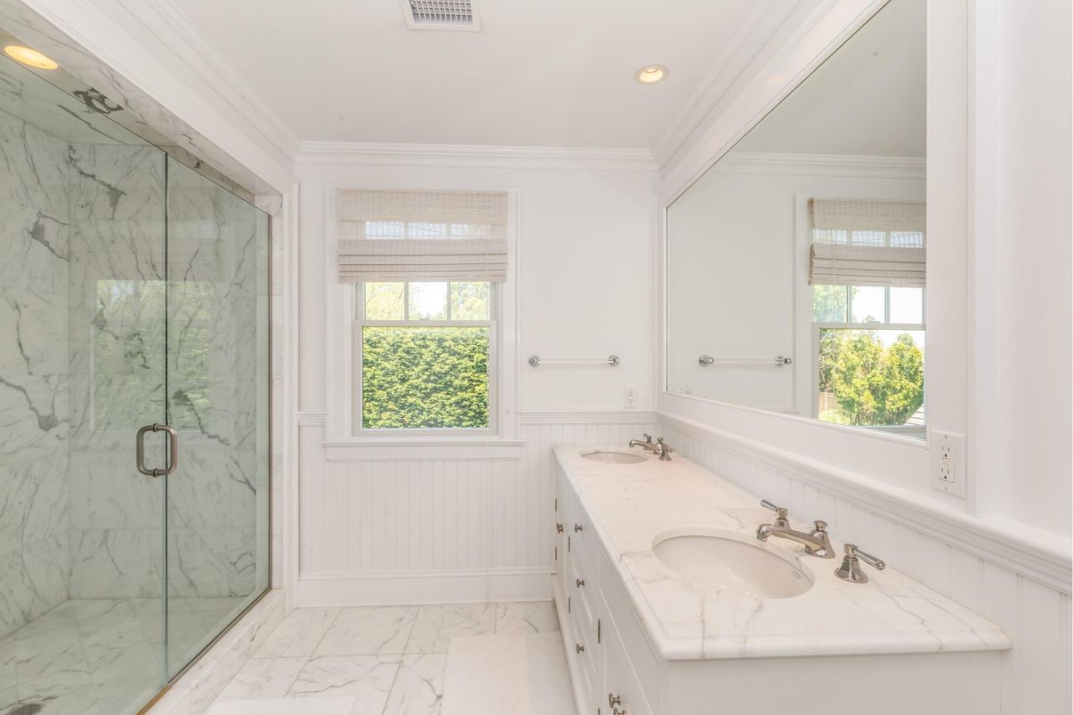 Bathroom, Dual Sink Vanities, Glass Shower, Interior, Marble, Marble Walls, Recessed Lighting