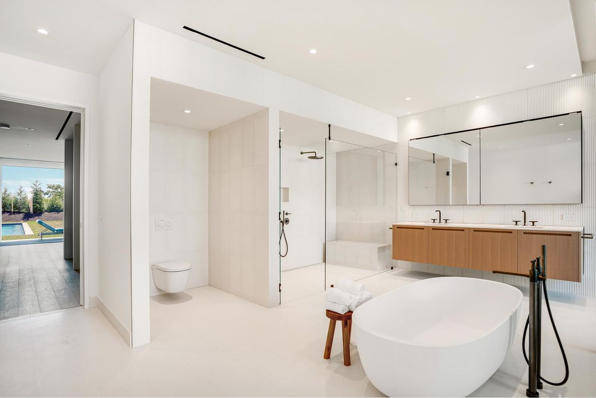 Bathroom, Dual Sink Vanities, Free Standing Baths, Glass Shower, Interior, Recessed Lighting, Wood Texture Flooring