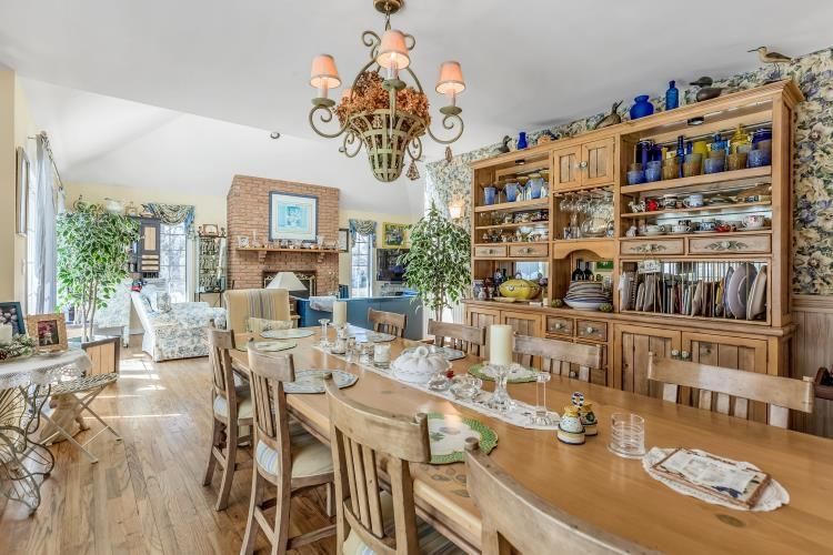 Chandelier, Dining room, Fireplace, Interior, Living room, Stone Walls, Wood Texture Flooring