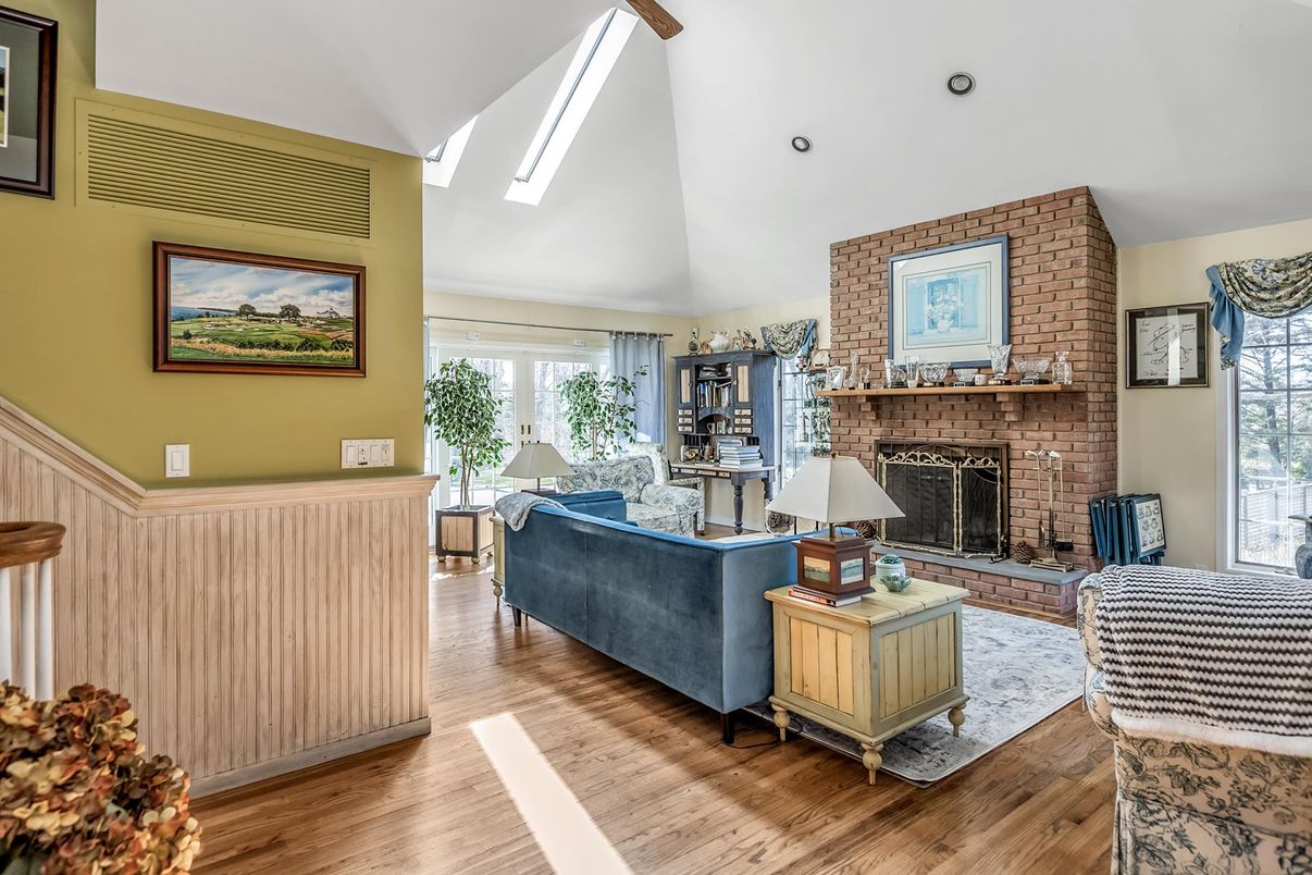 Fireplace, Interior, Living room, Recessed Lighting, Stone Walls, Wood Texture Flooring