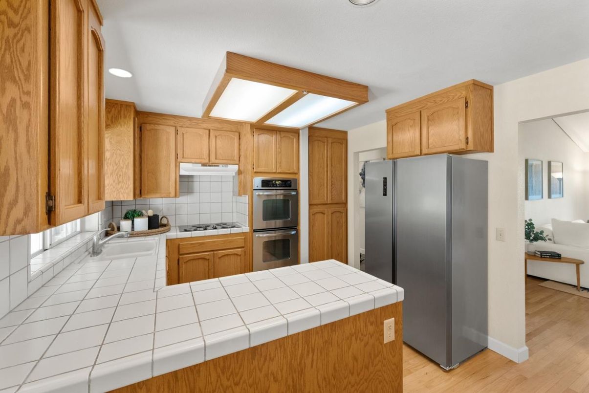 Interior, Kitchen, Recessed Lighting, Stainless Steel Appliances, Tile Countertops, Wood Texture Flooring