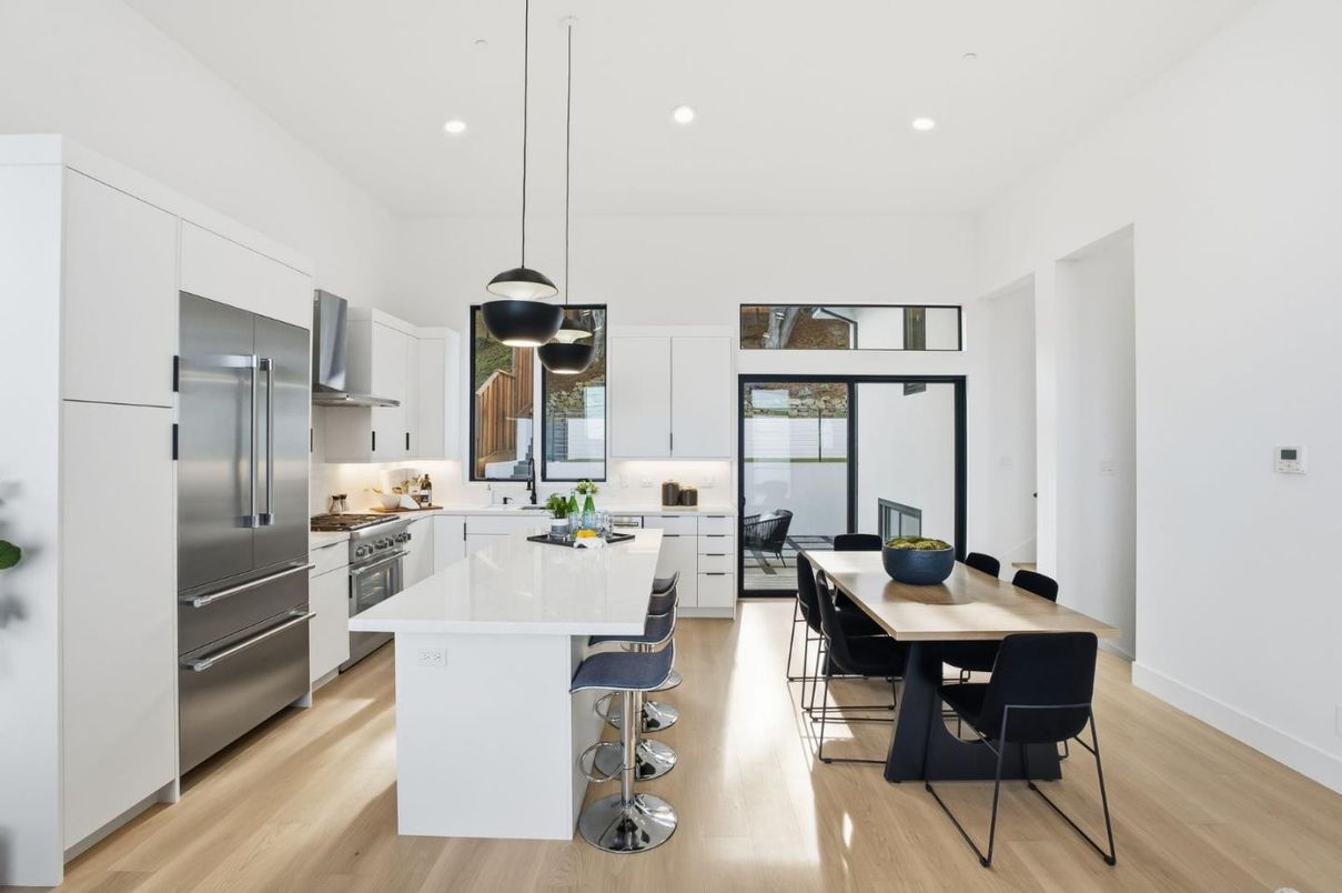 Dining room, Interior, Kitchen, Pendant Lights, Recessed Lighting, Stainless Steel Appliances, Wood Texture Flooring