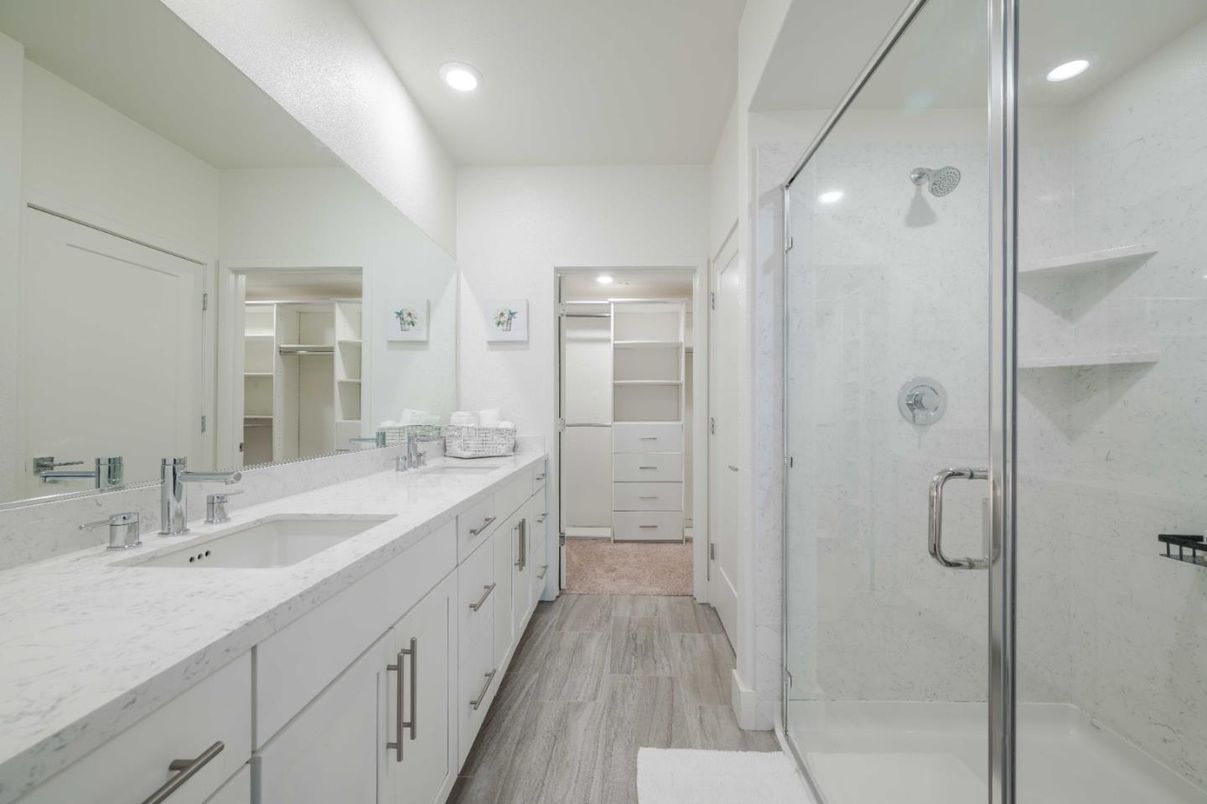 Bathroom, Dual Sink Vanities, Glass Shower, Interior, Recessed Lighting, Walk-in Closets, Wood Texture Flooring
