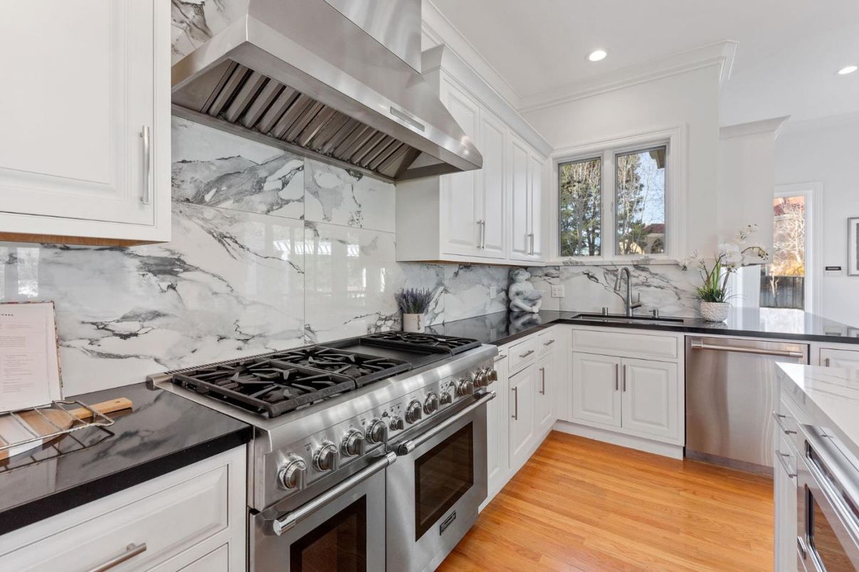 Interior, Kitchen, Marble Walls, Recessed Lighting, Stainless Steel Appliances, Wood Texture Flooring