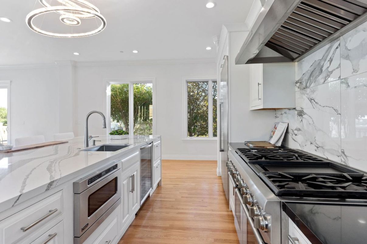 Interior, Kitchen, Marble Walls, Recessed Lighting, Stainless Steel Appliances, Wood Texture Flooring