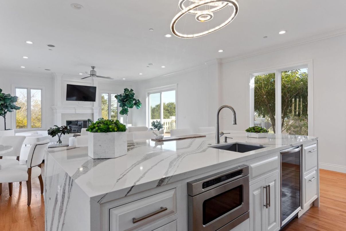 Dining room, Fireplace, Interior, Kitchen, Pendant Lights, Recessed Lighting, Stainless Steel Appliances, Wood Texture Flooring