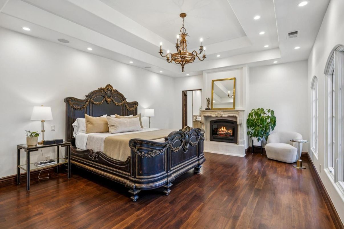 Bedroom, Chandelier, Fireplace, Interior, Recessed Lighting, Wood Texture Flooring