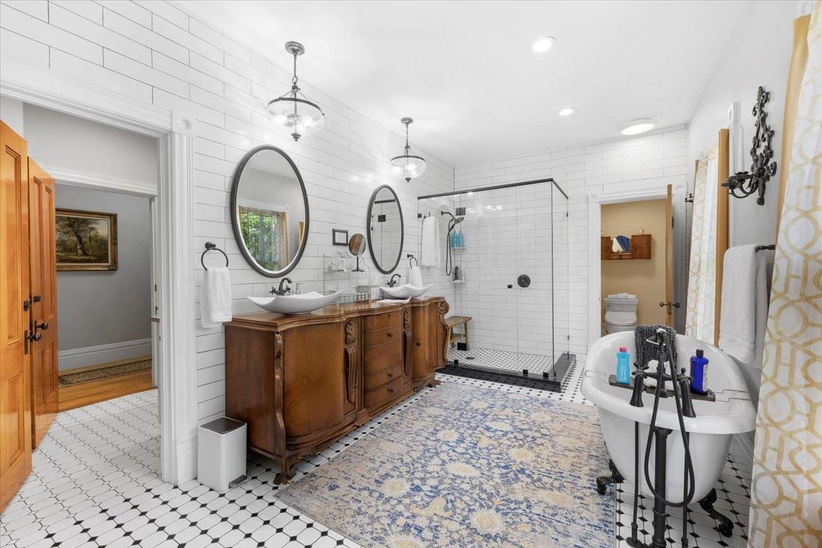 Bathroom, Dual Sink Vanities, Free Standing Baths, Glass Shower, Interior, Pendant Lights, Recessed Lighting, Wood Texture Flooring