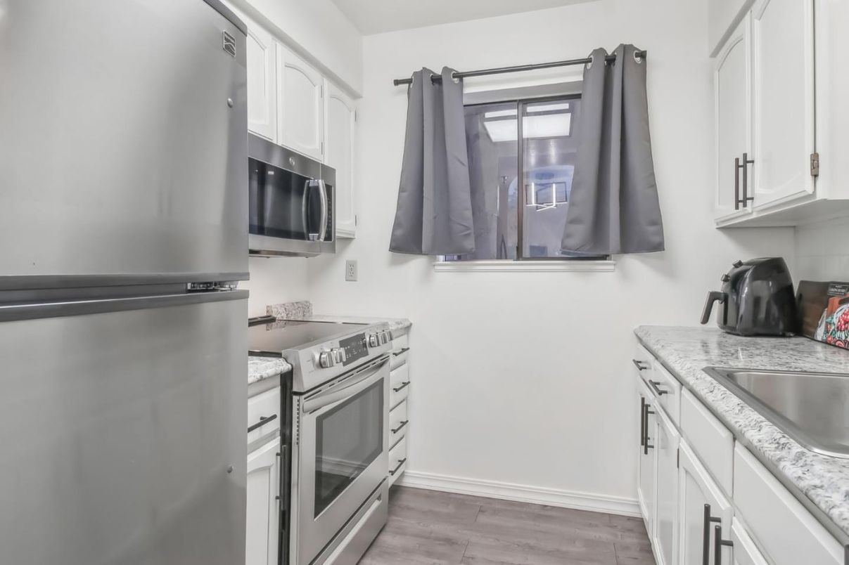 Interior, Kitchen, Stainless Steel Appliances, Tile Countertops, Wood Texture Flooring