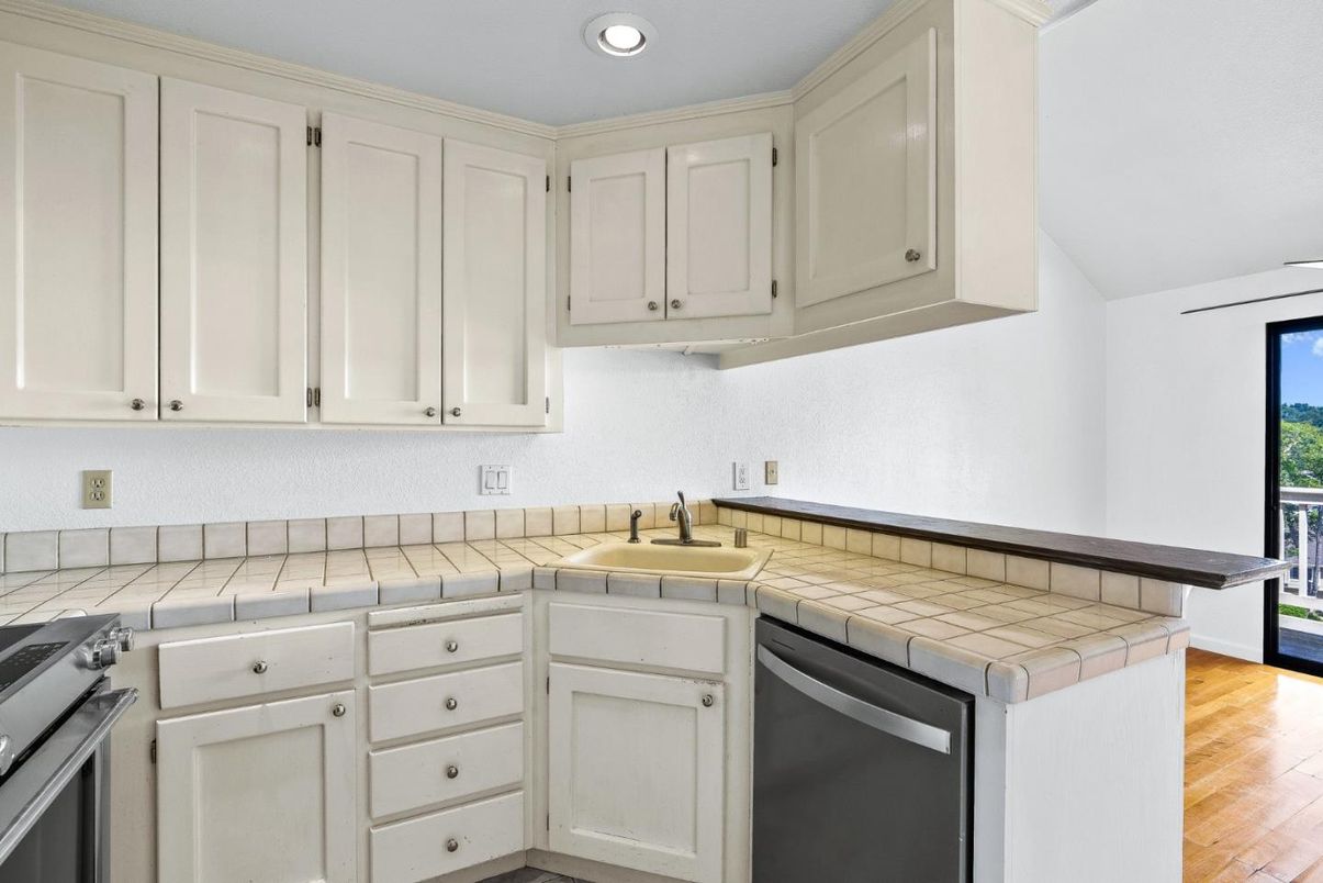 Interior, Kitchen, Recessed Lighting, Tile Countertops, Wood Texture Flooring