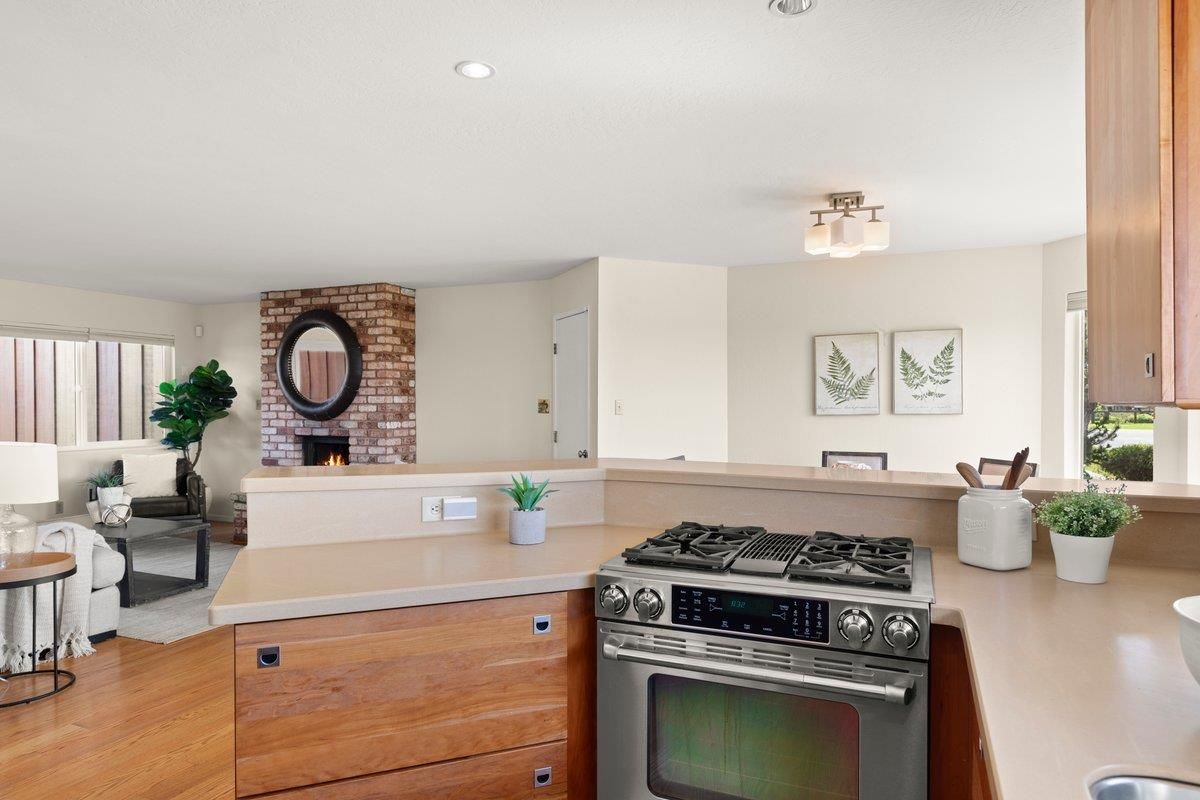 Fireplace, Interior, Kitchen, Living room, Recessed Lighting, Stainless Steel Appliances, Wood Texture Flooring
