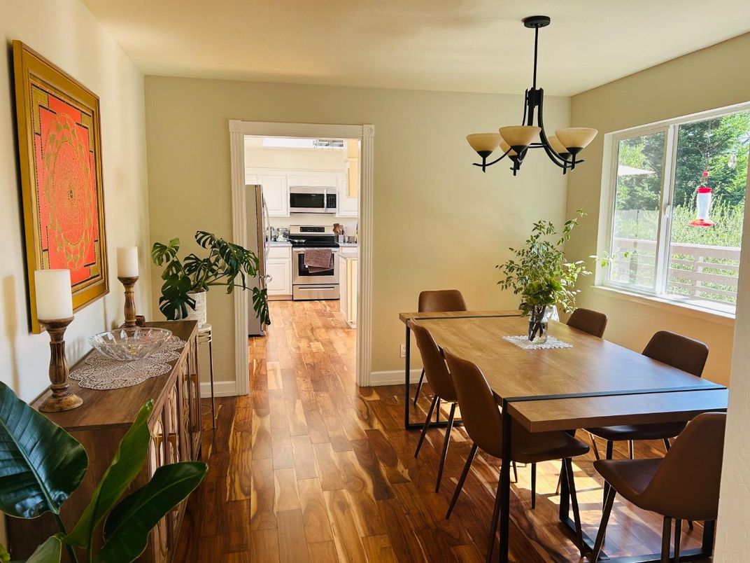 Chandelier, Dining room, Interior, Kitchen, Pendant Lights, Stainless Steel Appliances, Wood Texture Flooring