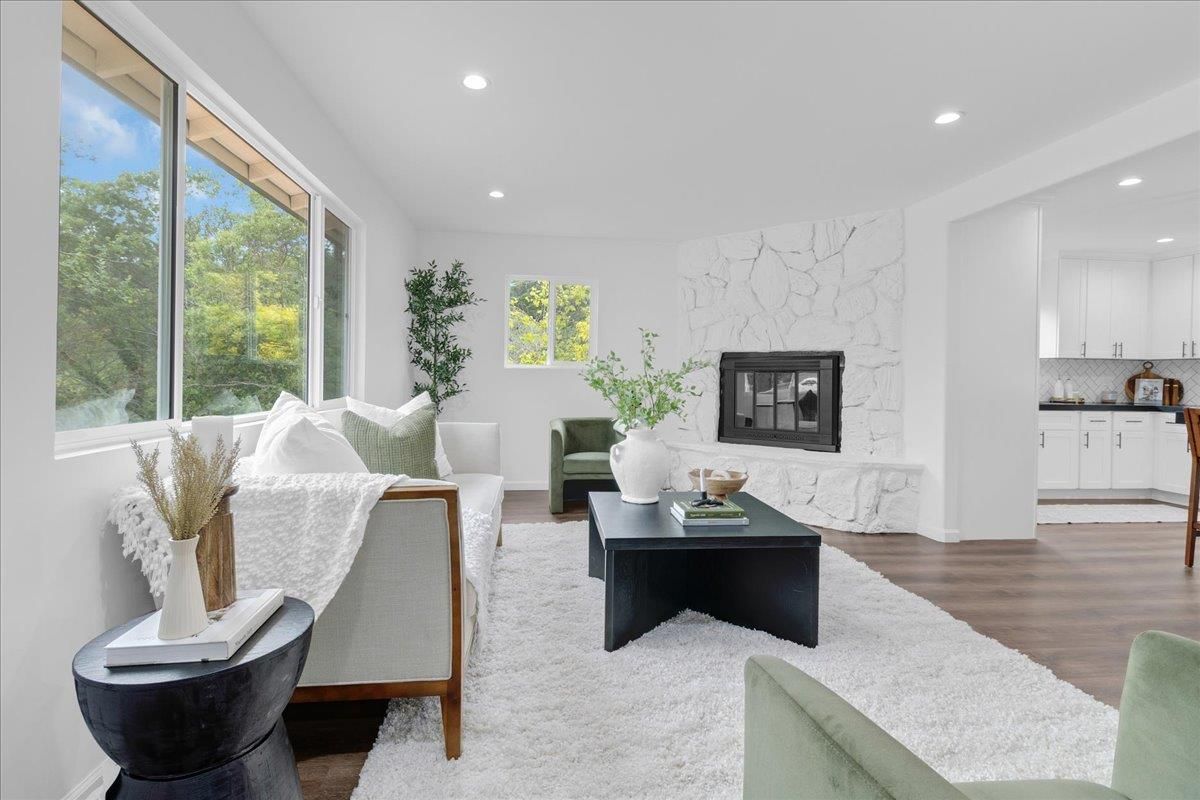 Fireplace, Interior, Living room, Marble Walls, Recessed Lighting, Wood Texture Flooring