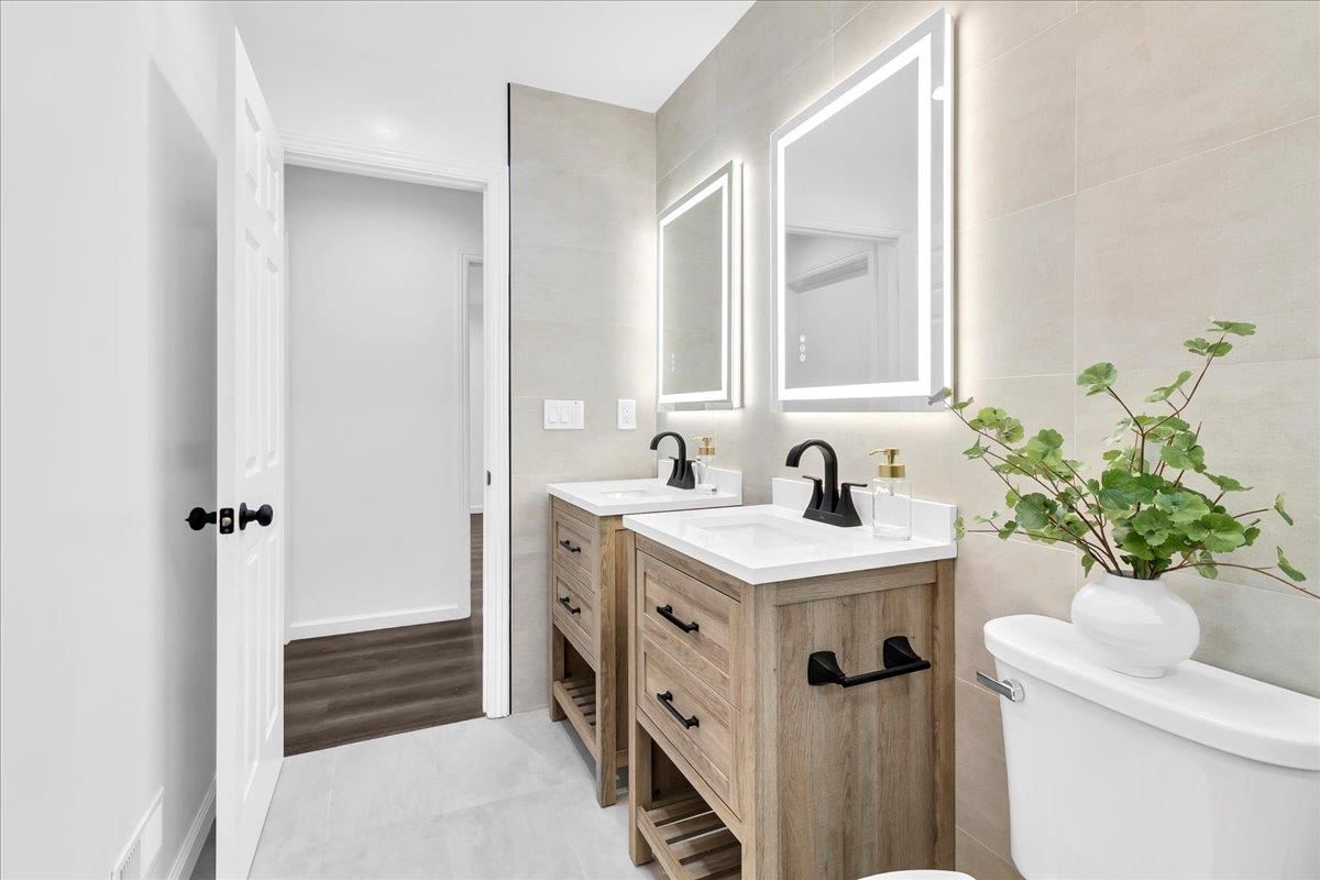 Bathroom, Dual Sink Vanities, Interior, Recessed Lighting, Wood Texture Flooring