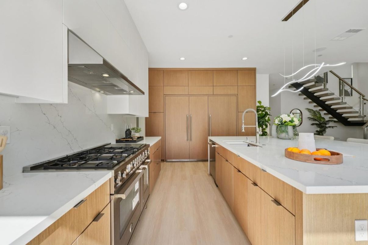 Interior, Kitchen, Marble Walls, Pendant Lights, Recessed Lighting, Stainless Steel Appliances, Wood Texture Flooring