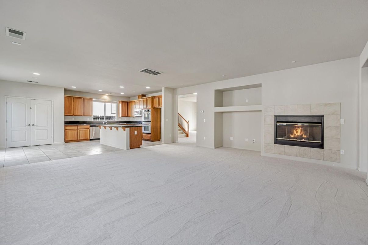 Empty room, Fireplace, Interior, Kitchen, Recessed Lighting, Stainless Steel Appliances
