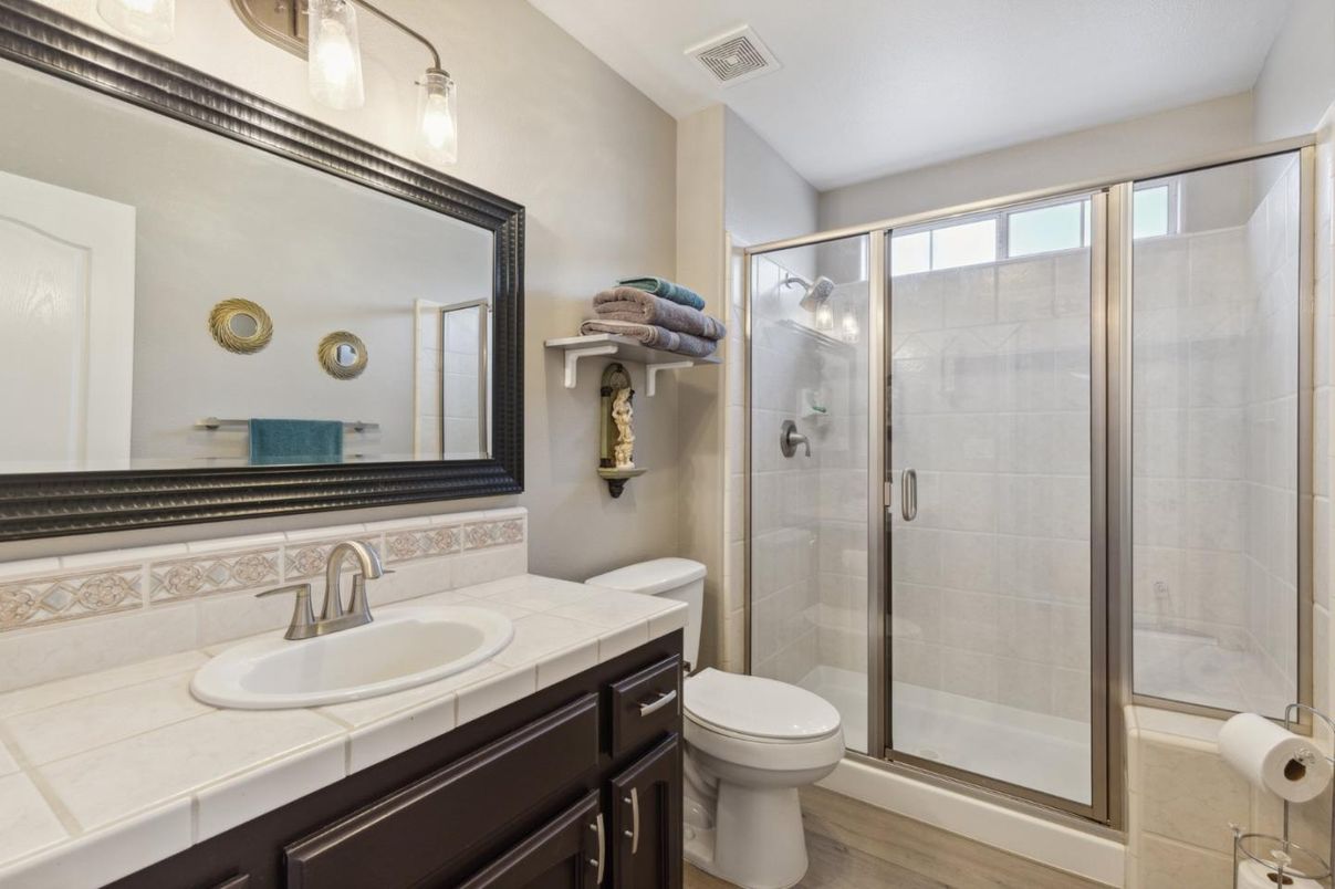 Bathroom, Glass Shower, Interior, Tile Countertops, Wood Texture Flooring