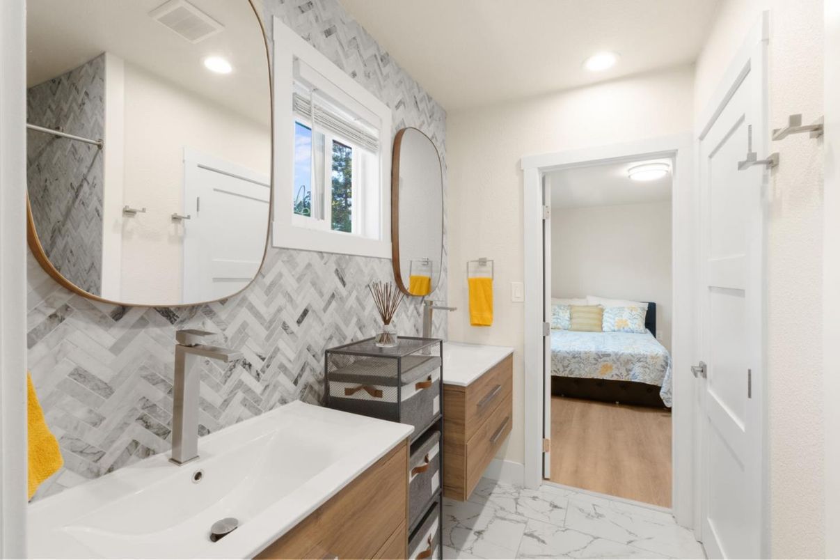 Bathroom, Bedroom, Dual Sink Vanities, Interior, Marble, Marble Walls, Recessed Lighting, Wood Texture Flooring