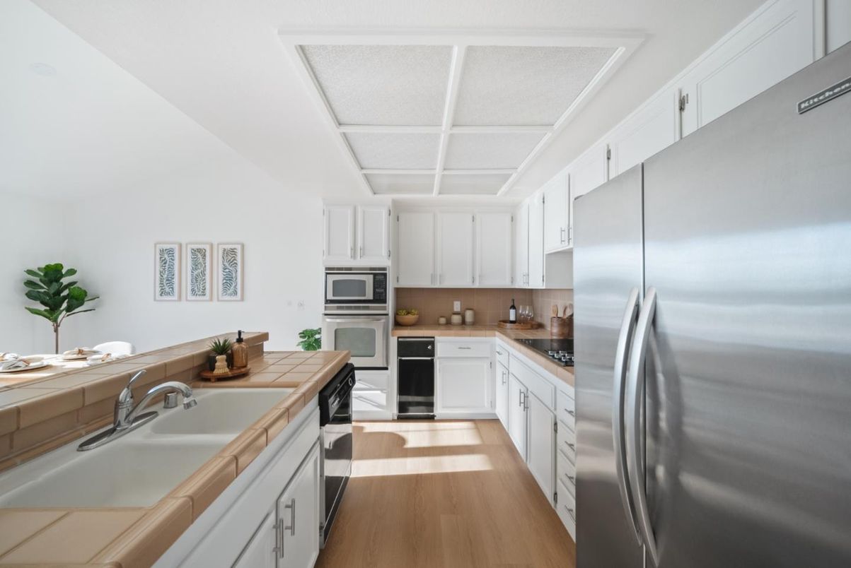 Interior, Kitchen, Stainless Steel Appliances, Tile Countertops, Wood Texture Flooring