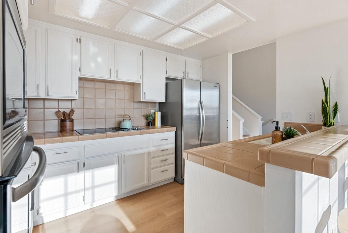 Interior, Kitchen, Stainless Steel Appliances, Tile Countertops, Wood Texture Flooring