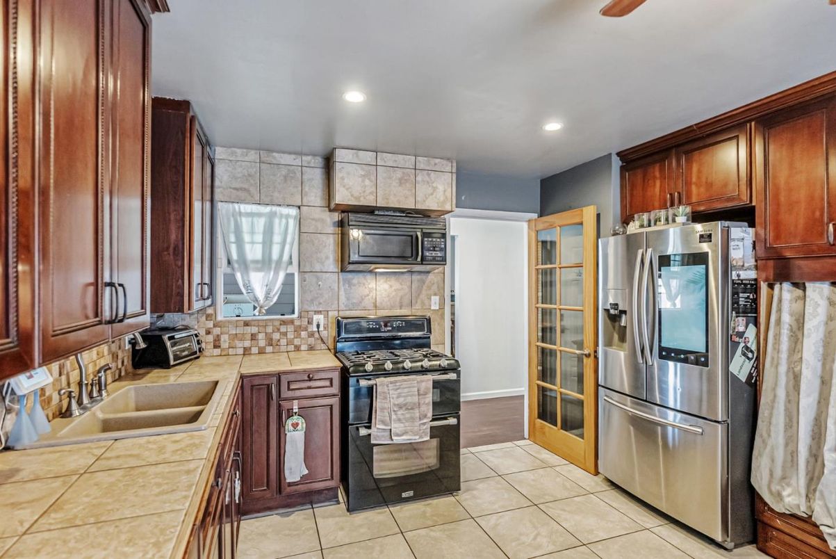 Interior, Kitchen, Recessed Lighting, Stainless Steel Appliances, Tile Countertops