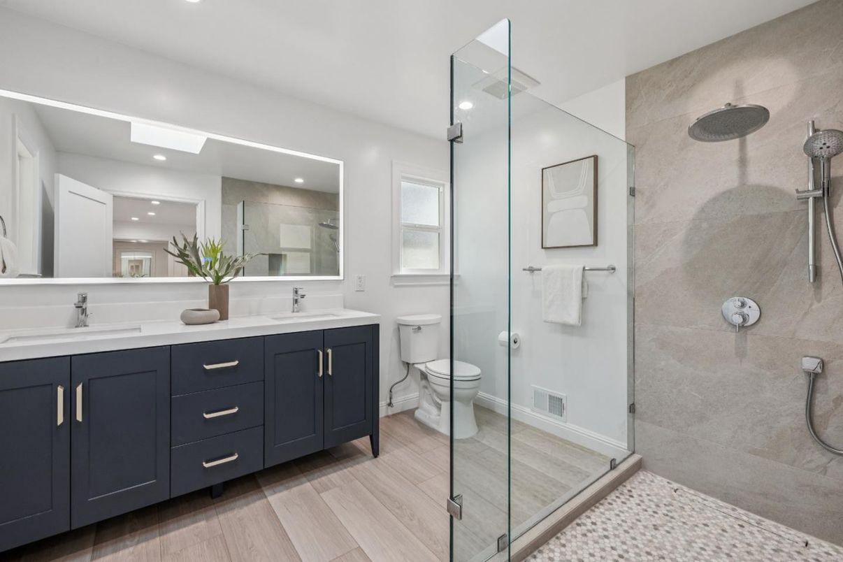 Bathroom, Dual Sink Vanities, Glass Shower, Interior, Recessed Lighting, Wood Texture Flooring