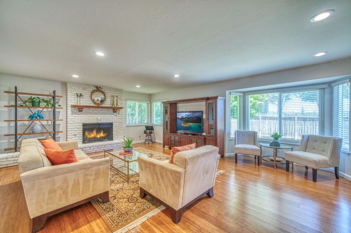 Fireplace, Interior, Living room, Recessed Lighting, Stone Walls, Wood Texture Flooring