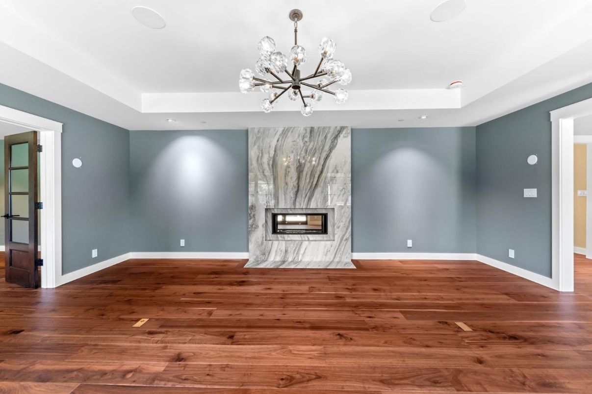 Empty room, Fireplace, Interior, Pendant Lights, Recessed Lighting, Wood Texture Flooring