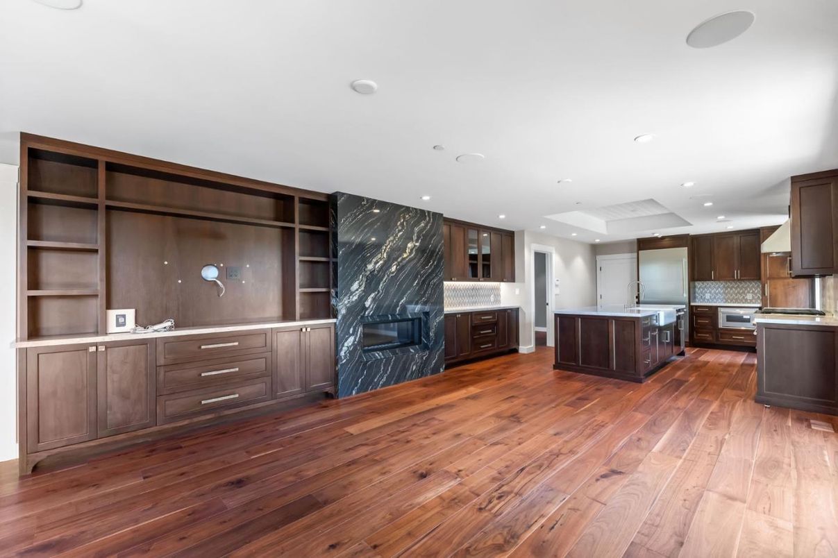 Fireplace, Interior, Kitchen, Marble Walls, Recessed Lighting, Stainless Steel Appliances, Wood Texture Flooring