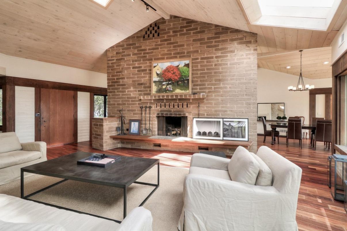 Chandelier, Dining room, Fireplace, Interior, Living room, Pendant Lights, Recessed Lighting, Stone Walls, Wooden Ceilings, Wood Texture Flooring