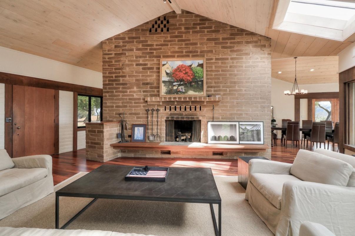 Chandelier, Dining room, Fireplace, Interior, Living room, Pendant Lights, Recessed Lighting, Stone Walls, Wooden Ceilings, Wood Texture Flooring