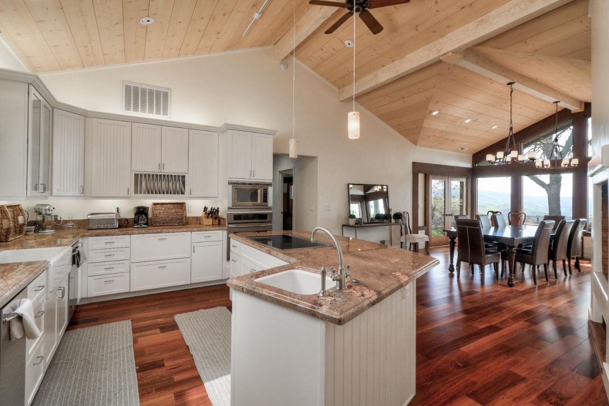 Chandelier, Dining room, Interior, Kitchen, Pendant Lights, Recessed Lighting, Stainless Steel Appliances, Wooden Beams, Wooden Ceilings, Wood Texture Flooring