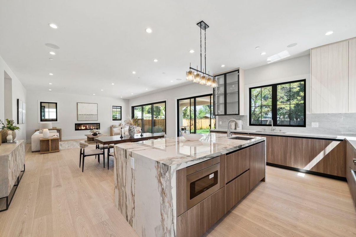 Chandelier, Dining room, Fireplace, Interior, Kitchen, Living room, Pendant Lights, Recessed Lighting, Wood Texture Flooring
