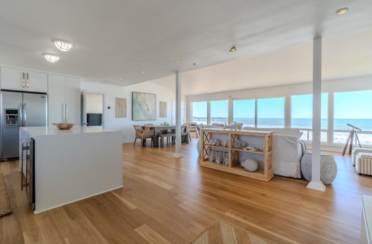 Dining room, Interior, Kitchen, Living room, Recessed Lighting, Stainless Steel Appliances, Water, Wood Texture Flooring