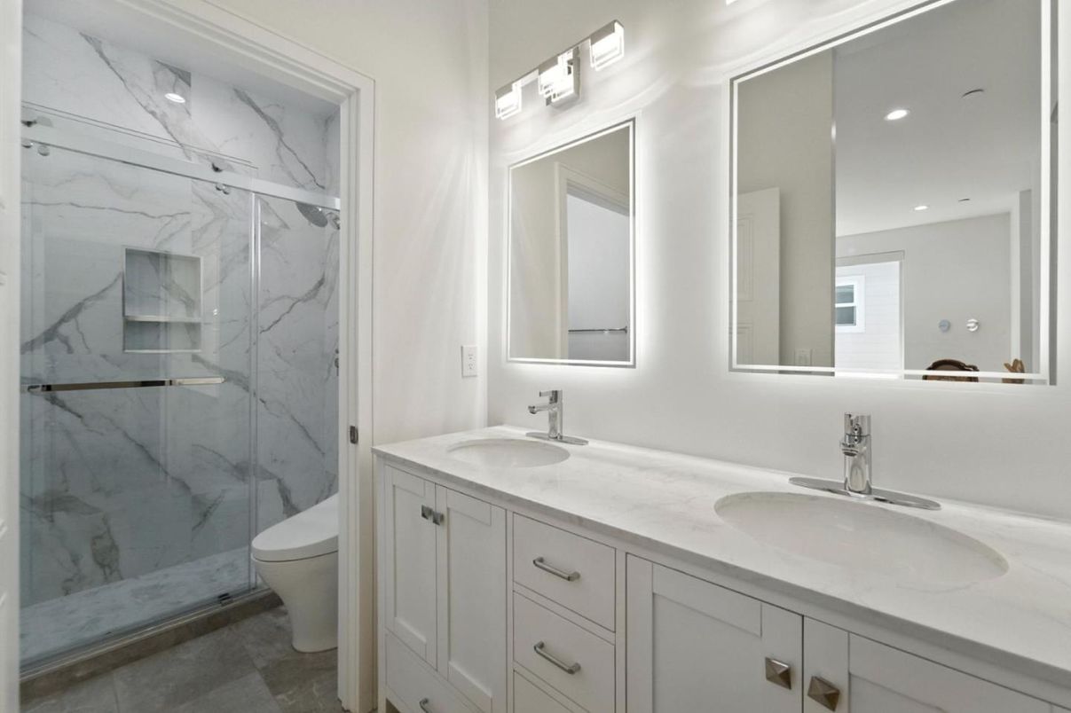 Bathroom, Dual Sink Vanities, Glass Shower, Interior, Marble Walls, Recessed Lighting