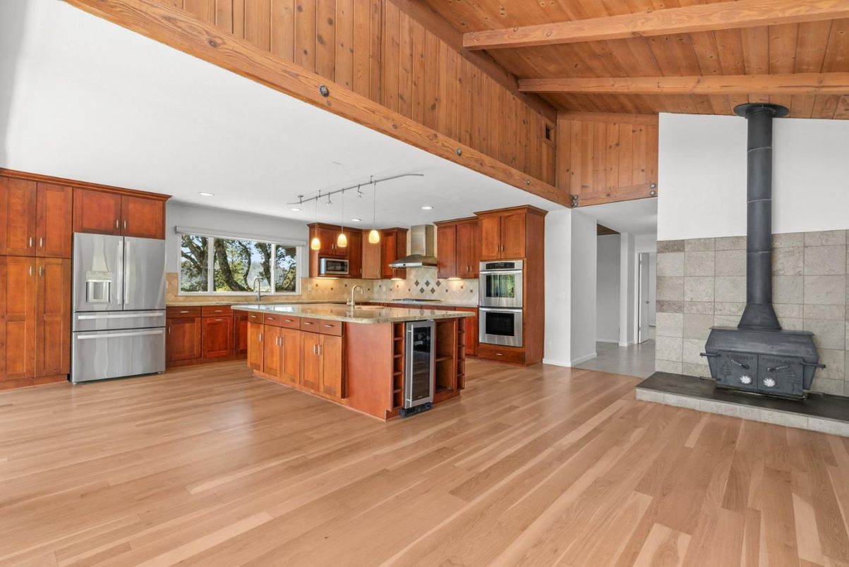 Fireplace, Interior, Kitchen, Pendant Lights, Recessed Lighting, Stainless Steel Appliances, Wooden Beams, Wooden Ceilings, Wood Texture Flooring