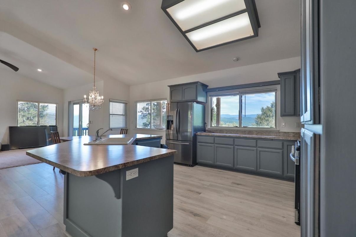 Chandelier, Dining room, Interior, Kitchen, Recessed Lighting, Stainless Steel Appliances, Water, Wood Texture Flooring