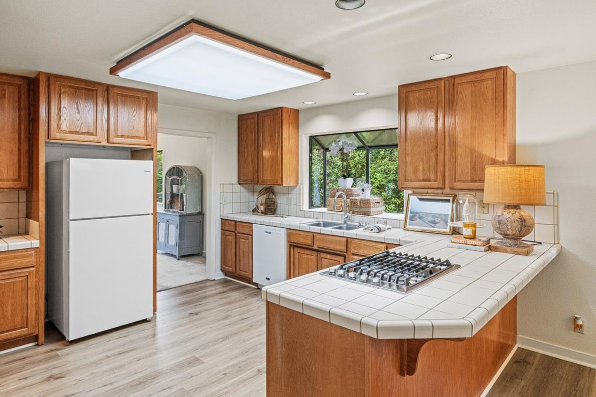 Interior, Kitchen, Recessed Lighting, Tile Countertops, Wood Texture Flooring