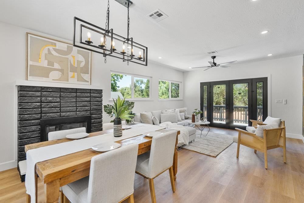 Chandelier, Dining room, Fireplace, Interior, Living room, Recessed Lighting, Wood Texture Flooring